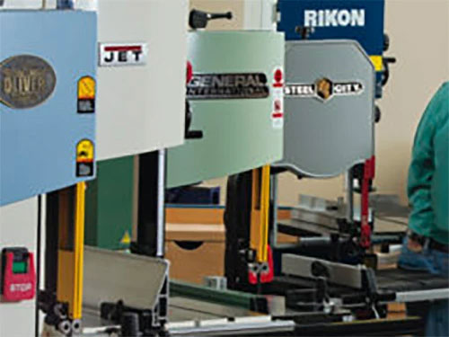 Five fourteen inch band saws in a workshop
