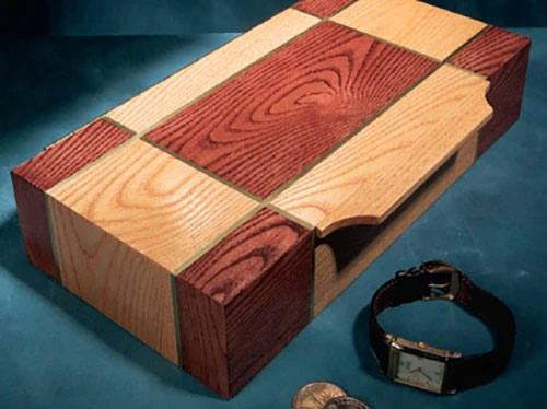 Small box with stain patterns and small brass inlay pattern