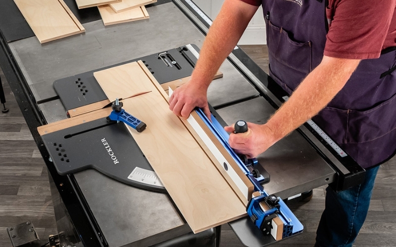 Close up of man using table saw