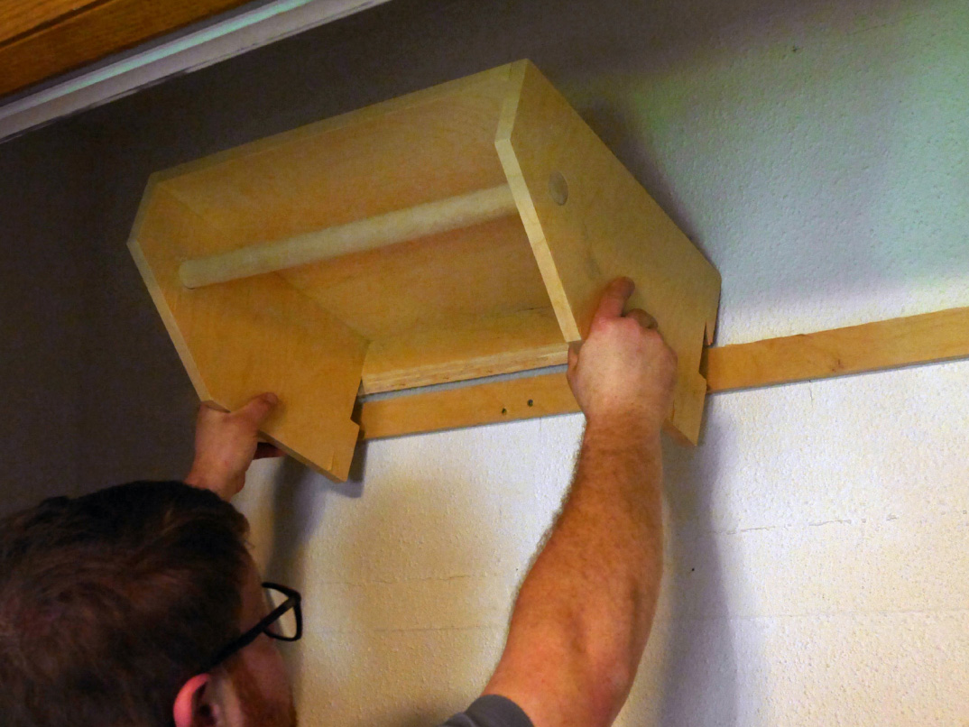 Hanging shelf unit in closet