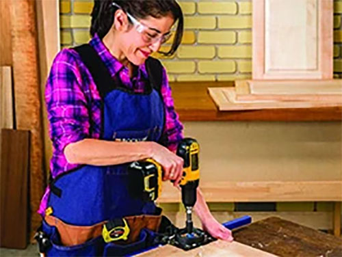 Cutting hinge installation holes with drill guide