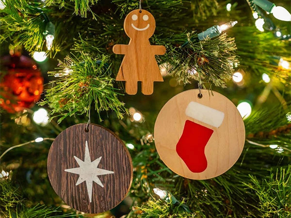 Wood and epoxy ornaments hanging on a tree