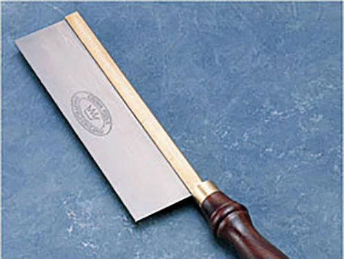 Gentlemen's-style hand saw on workbench