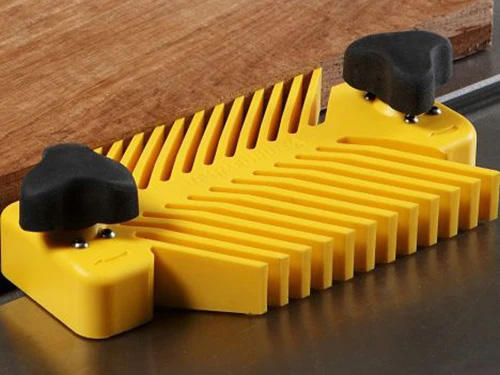 Magswitch universal featherboard attached to table saw guiding cut