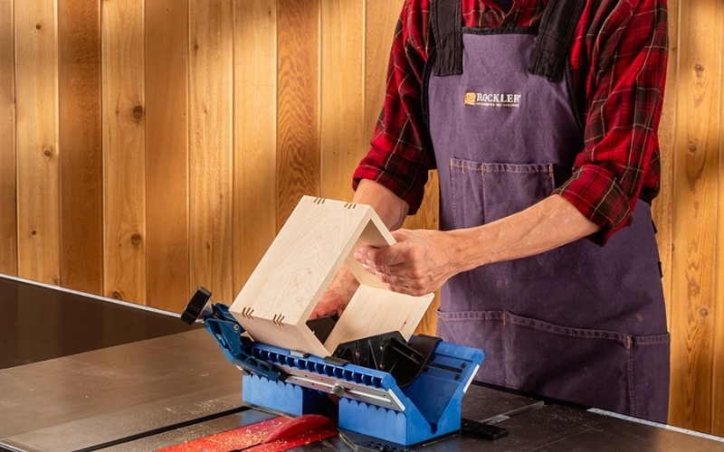 man using table saw jig