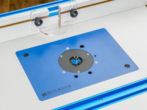 Router table with phenolic router plate