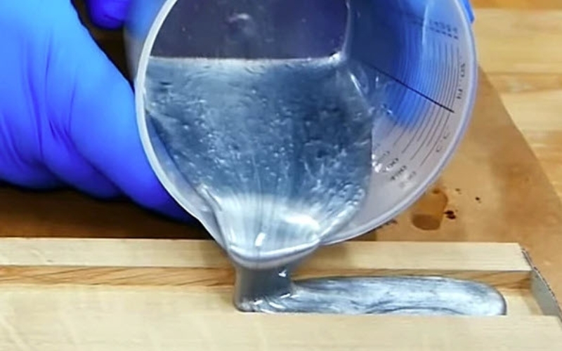 pouring epoxy into a mold