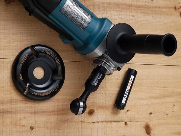 Arbortech power carving tool with cutting head and turbo shaft accessories