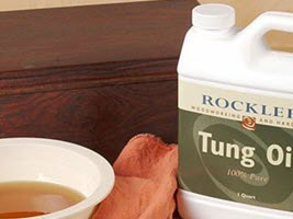 Bottle and bowl of tung oil wood finish