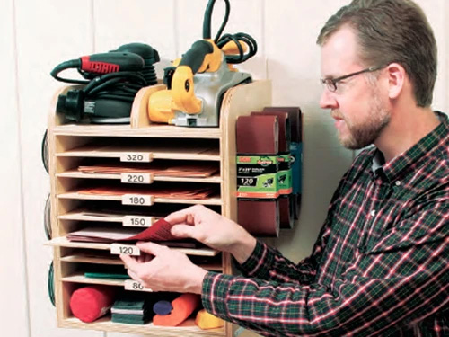 Wall mounted storage system for sandpaper