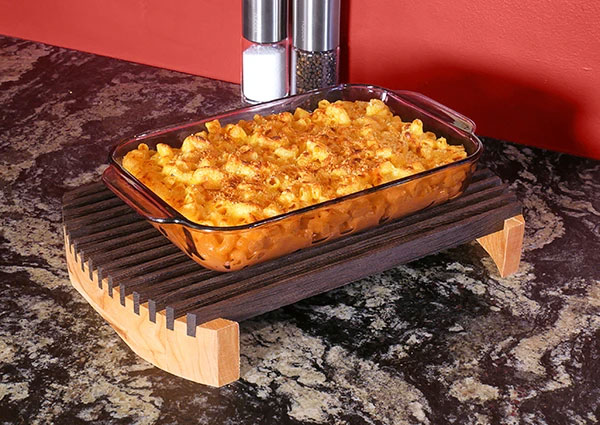 Mac and cheese resting on trivet