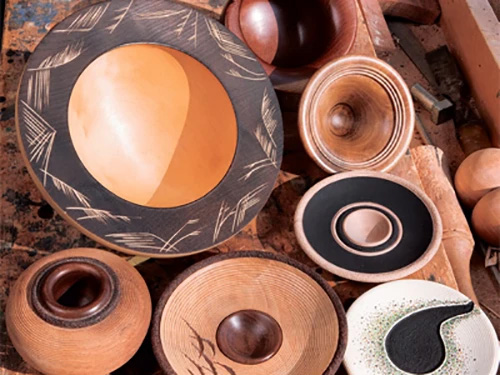 Bowls with coloring and carved elements