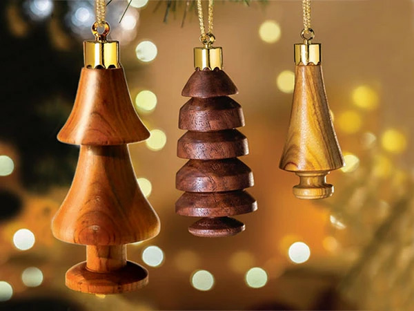 Three turned wood tree ornaments