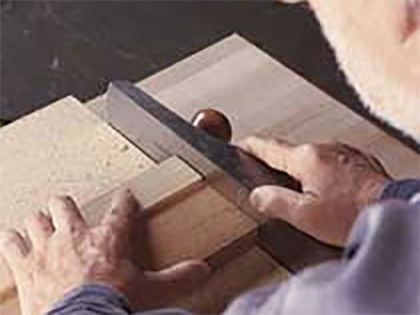 Planing a board fixed to a shooting board