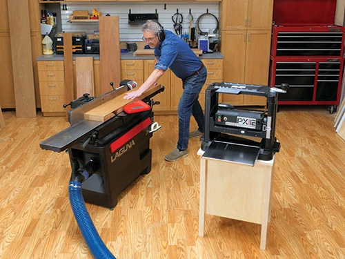 Running freshly planed board through a jointer