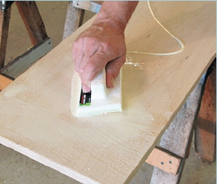 Using a paint applicator to spread glue