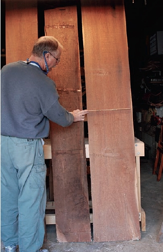 Laying out walnut planks for highboy parts