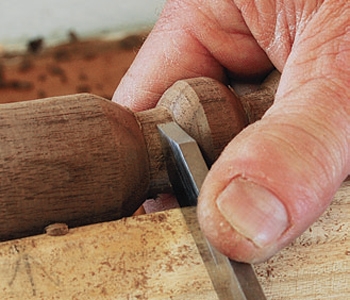 Cutting filets on the finial with a parting tool