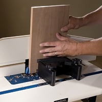 Cutting board with a featherboard and fence
