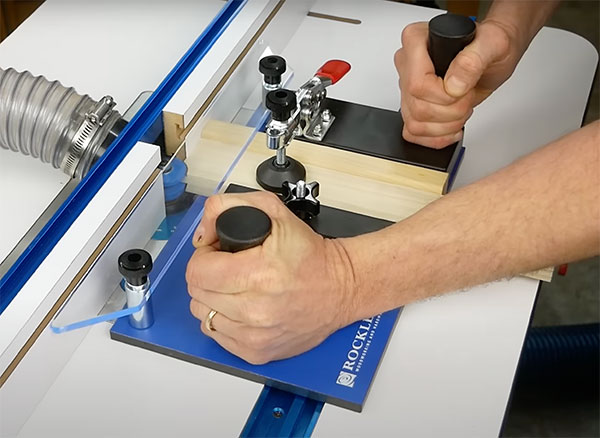 cutting rail on router table with coping sled