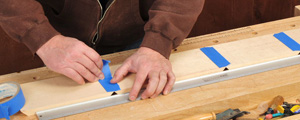 Holding together parts of a miter jointed frame with tape