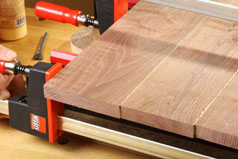 Adjust pressure on bar claps to ensure a tight fit during panel glue-up