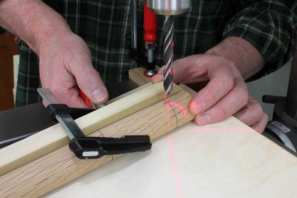 Aligning drilling jig using laser cross on drill press