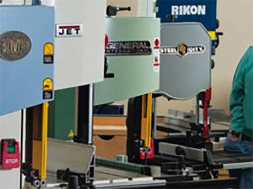 Five fourteen inch band saws in a workshop