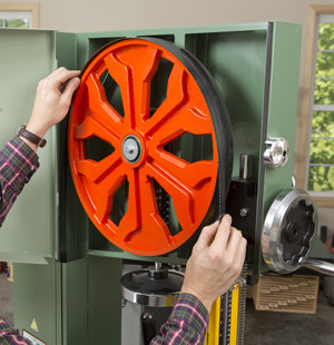 Fitting tire on upper wheel of band saw