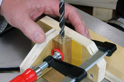 Marking center point of blank with drill bit