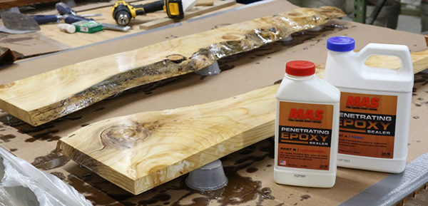 Two live-edge boards pre-treated with epoxy