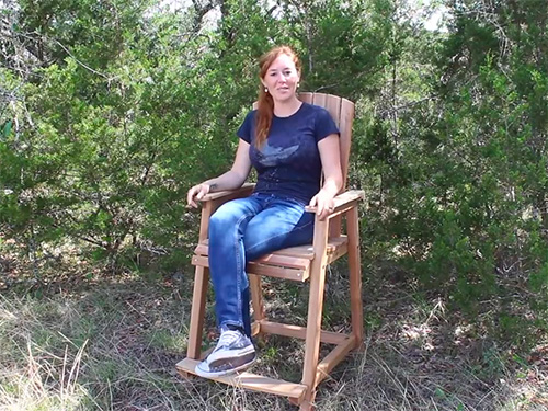April Wilkerson demonstrating her bar height adirondack chair