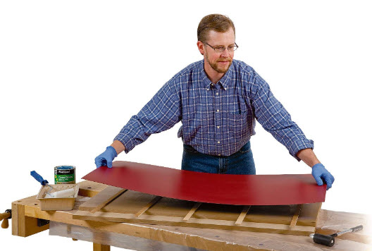 Attaching laminate top to table saw to outfeed table