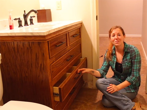 April Wilkerson demonstrating her finished bathroom vanity project