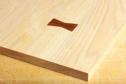 Butterfly inlay that has been installed across the grain