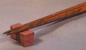Using a purpleheart dovetail inlay as a holder for chopsticks