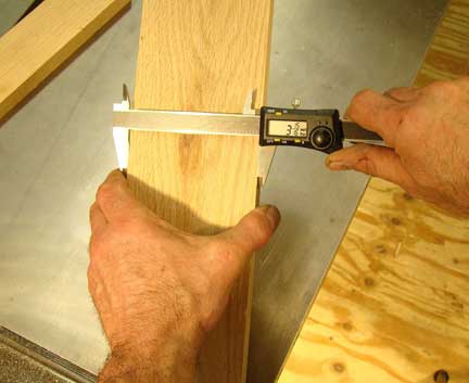 Checking width of freshly ripped board
