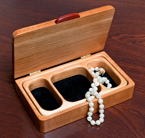 A small jewelry box made from cherry wood