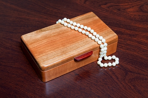 Small jewelry box made with cherry wood