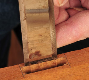 Cleaning a mortise cut with a chisel