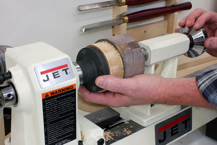 Using lathe to mount and clamp glue block in place