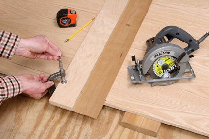 Clamping a circular saw jig to a plywood panel