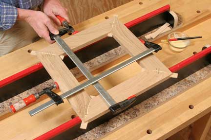 Clamping and gluing miter jointed picture frame