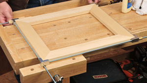Using a frame clamp kit to fit miter joints