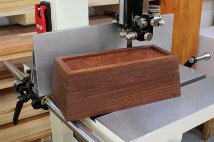 Continuous grain box with tapered sides