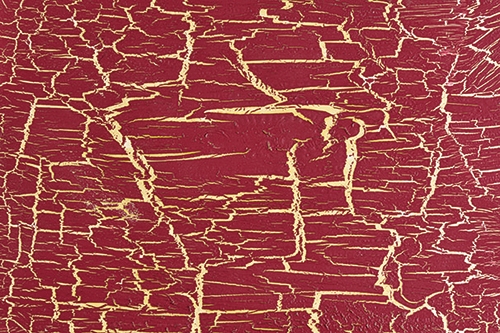 Red finish that has been intentionally cracked and aged