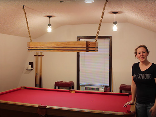 April Wilkerson and her oak and walnut pool table light