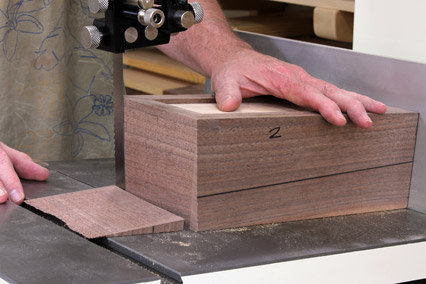 Making tapered cuts on continuous grain box