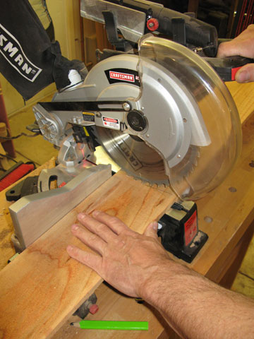 Using miter saw to cut cedar fencing to size