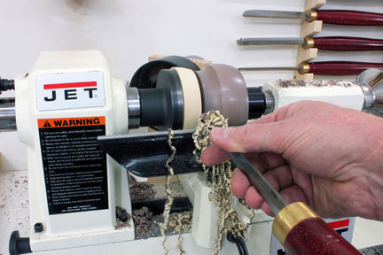 Using a parting tool to cut groove and separate turning from glue block